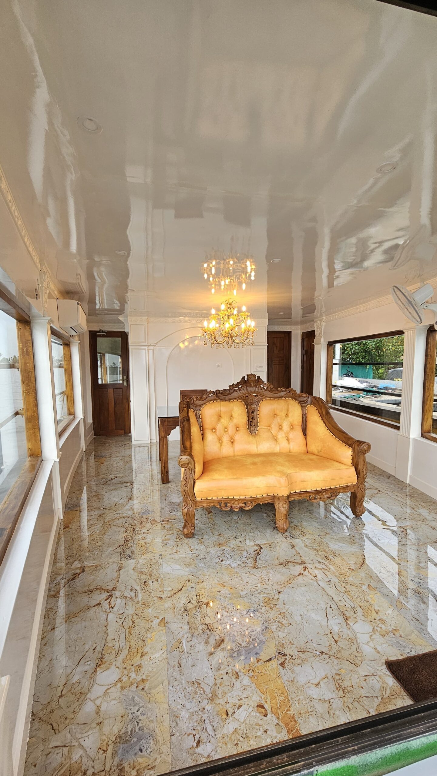 Spacious wooden living area onboard a luxury houseboat